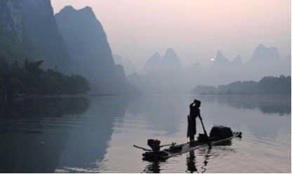 Fisherman on the misty Li River