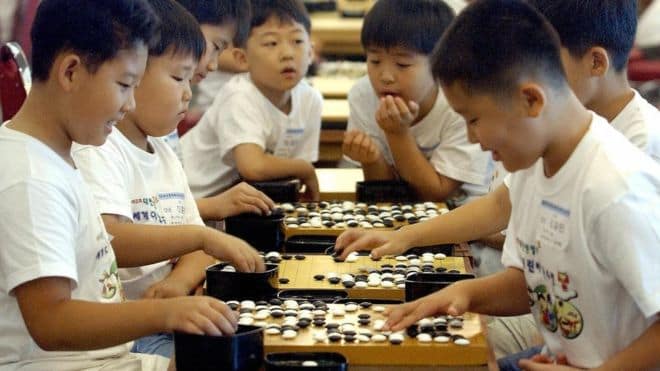 Chinese Students Playing Go Game