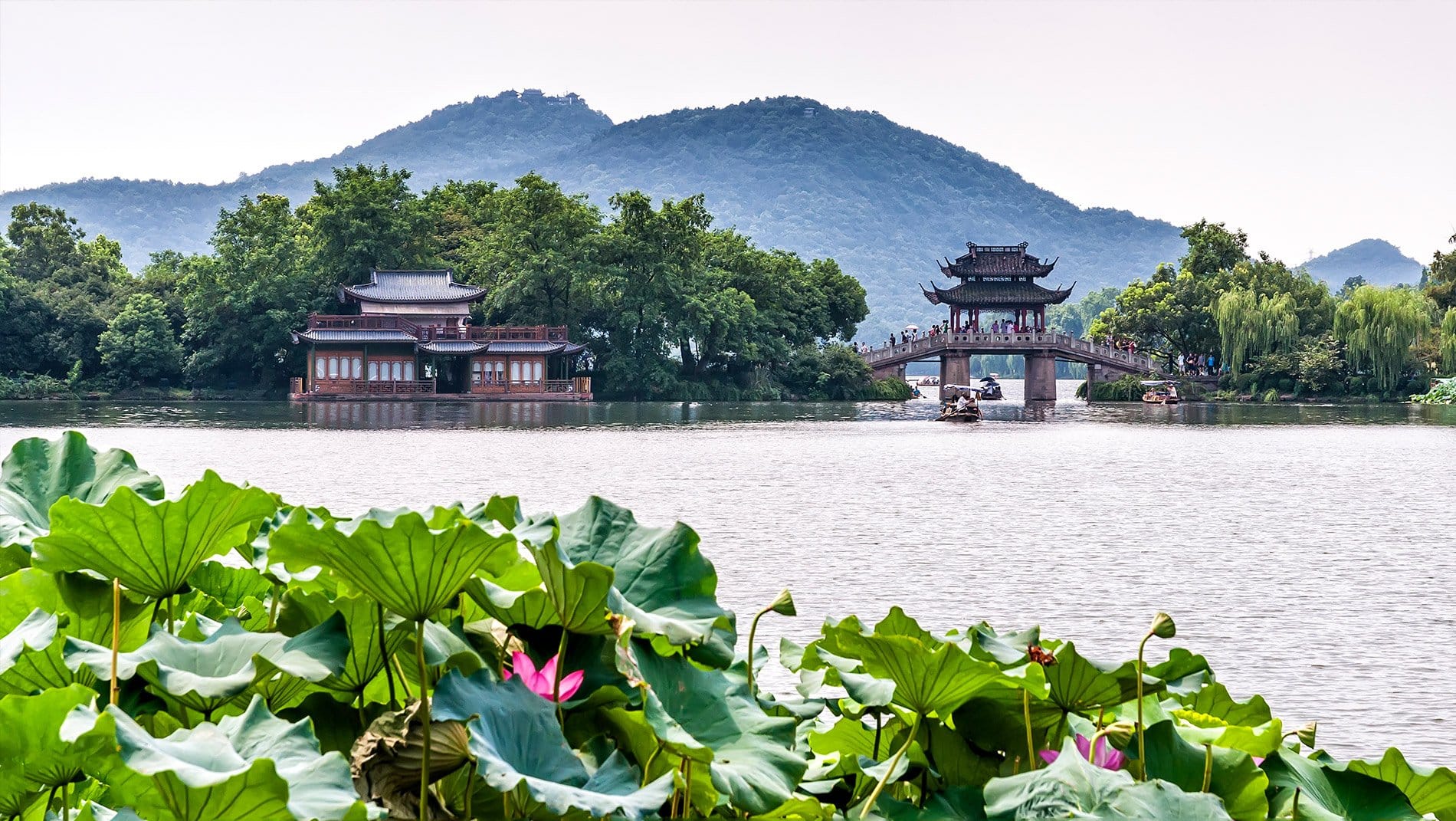 West Lake~West Lake has defined scenic elegance in East Asia for many centuries. Visitors will see its lakeside willow trees, ornamental bridges and causeways as a quintessentially Chinese idiom.