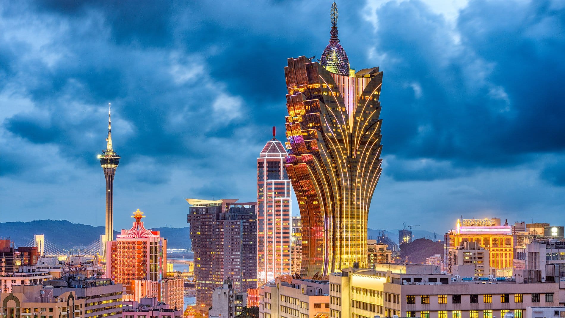 Casinos~The Grand Lisboa Hotel, in the center of this photograph, is the tallest and most distinctive hotel in Macau. It is the most recent of three casino buildings belonging to Stanley Ho, the original architect of the gaming scene in Macau.
