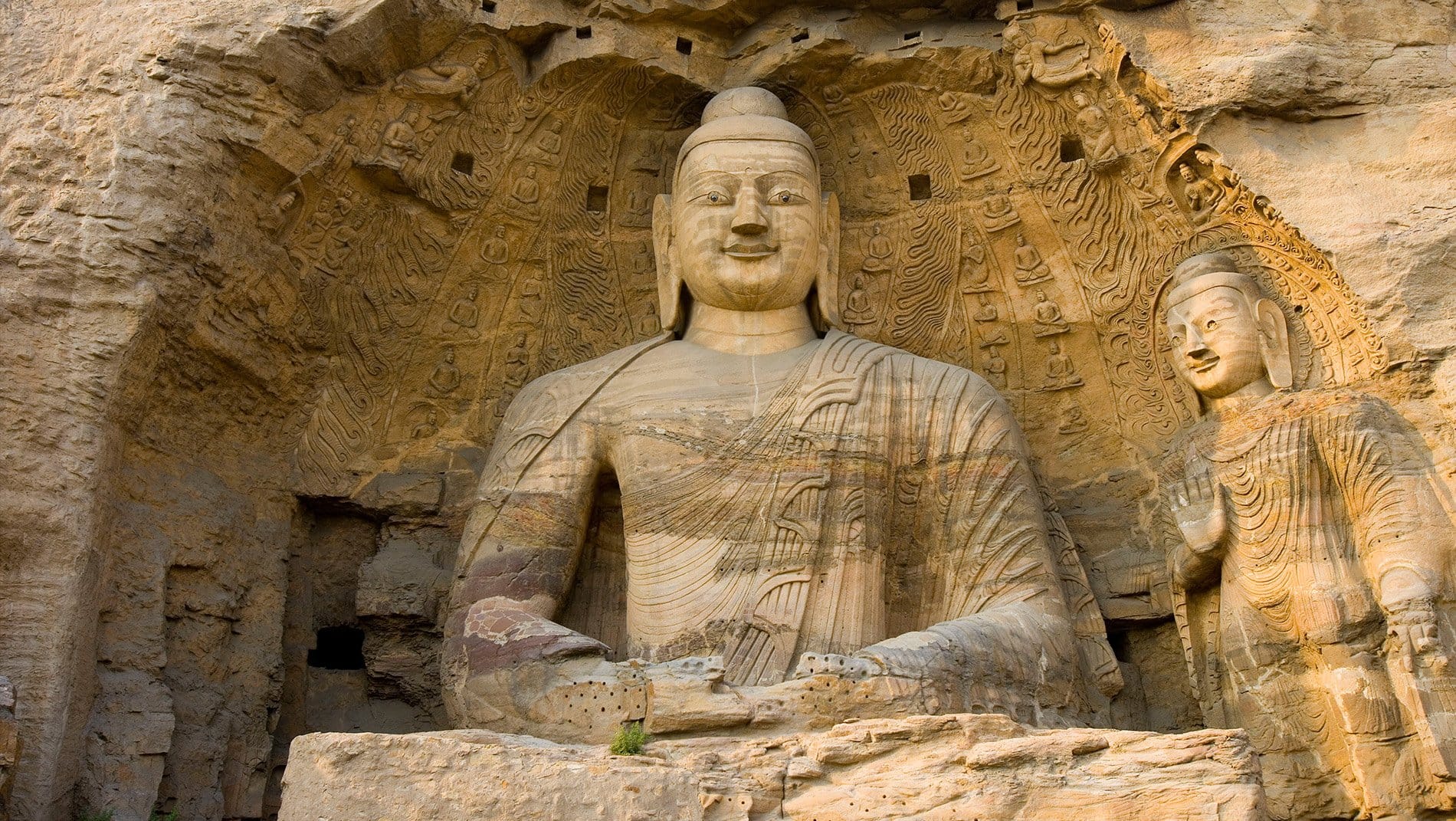 Yungang Caves~With over 250 caves and 50,000 sculptures, carved out over more than a century, the Yungang grottoes are an outstanding achievement of Buddhist architecture and art.